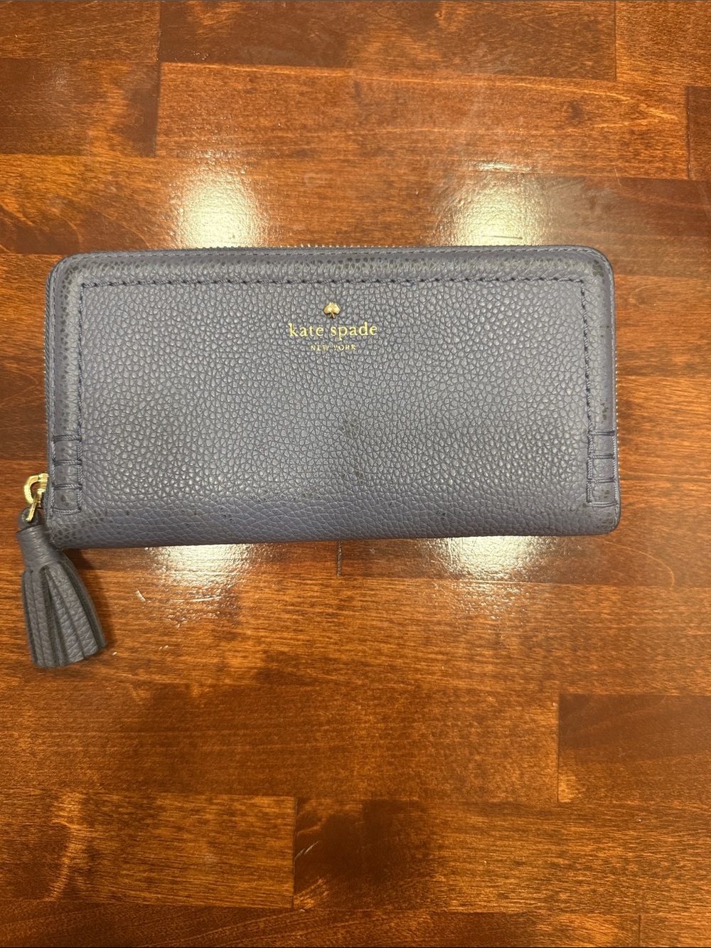 kate spade blue pebbled leather zip-around wallet with tassel